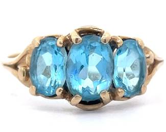 Three-Stone Oval Cut Natural Blue Topaz Ring in Yellow Gold