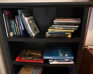 Black Wooden Bookshelf with Assorted Books