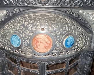 Ornate Cast Iron Parlor Stove with Ceramic Medallions