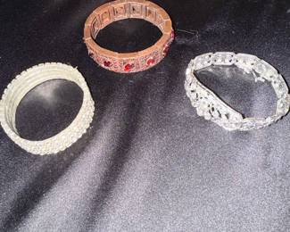 Lot of Three Costume Bracelets: Red Stone Link, Clear Rhinestone Band, and Filigree Rhinestone