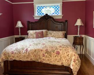 Dark Wood Sleigh Bed with Upholstered Headboard and Floral Bedding