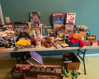 Vintage toys--a lot of them new in the box. Fisher Price, Tupperware, Lego, Snoopy, Knickerbocker