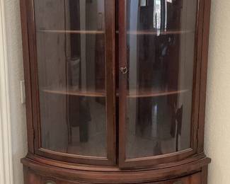 Elegant curved brown corner china cabinet L  :69” W: 39” D:18”