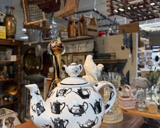 porcelain teapot, baskets, bird figurines, pink glass basket 