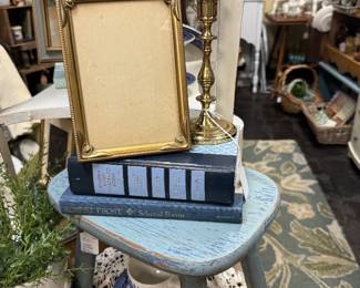 vintage books, blue stool, frames, decorative plates, baskets
