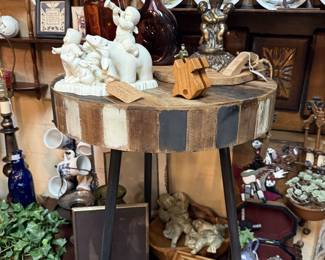 wooden and metal side table, plates, candlesticks, vintage bottles