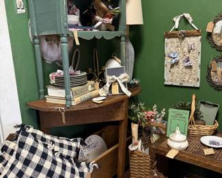 wall hangings, woven baskets, throw pillows, plates, vintage books