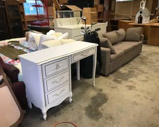 Small white desk, golf clubs, sofa, washer and dryer 