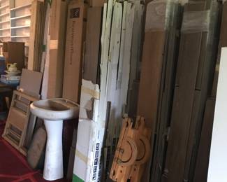 Assorted plank flooring, laminate and vinyl. Pedestal sink 