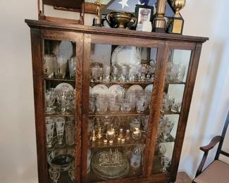 China cabinet.  Full of gold leaf glassware