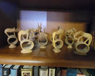 Carved figural napkins rings