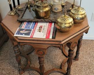 Octagonal table.  Brass items