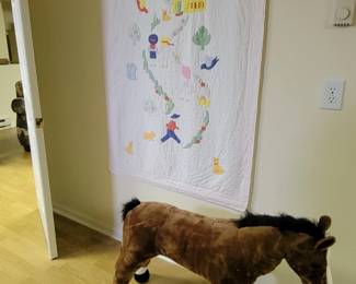 Large pony.  Beautiful quilt