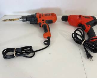 Two Black  Decker Electric Drills