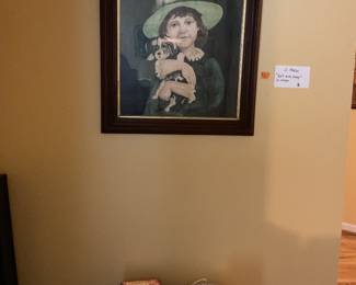 Titled girl with puppy. 