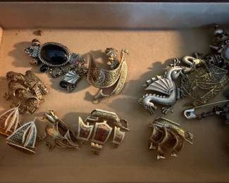 Dragon pins and brooches