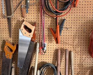 Assorted Hand Saws, Jumper Cables, and Garden Tool Handles