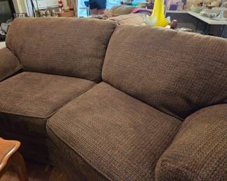 Couch and love seat with pillows