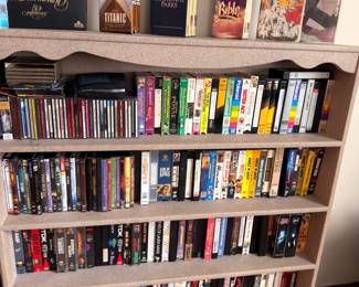 Bookshelf Full of DVDs VHS Tapes Movies Books Media Collection Shelving Unit Entertainment Lot