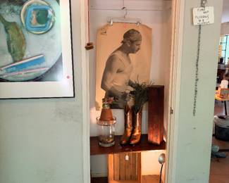 My car looks kind of weird in the closet, but it’s one of several vintage police marksman posters we have…