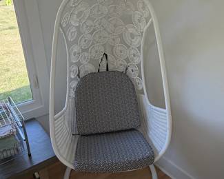 White Wicker Hanging Chair with Geometric Pattern Cushions and Stand