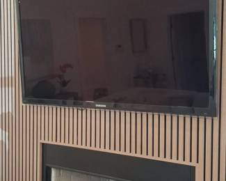 Samsung Flat Screen Television mounted on Wood Slat Wall