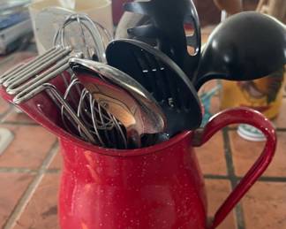 Metal red pitcher w/utensils 