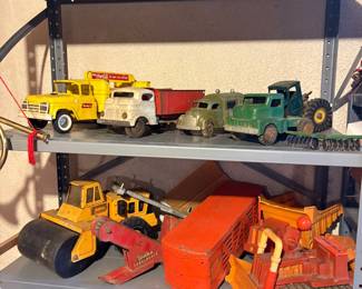 vintage metal tonka trucks, including one Coca Cola truck