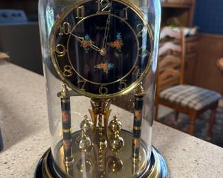 Vintage-style anniversary or rotating pendulum clock