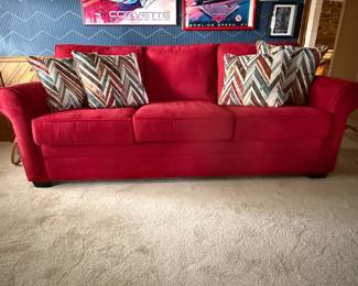 Beautiful red couch with 4 matching pillows