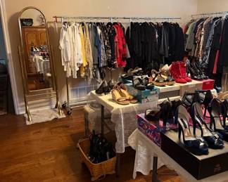 more clothes and shoes and a beautiful gold mirror