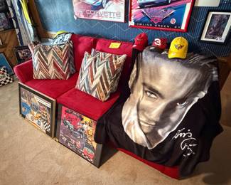 Beautiful red couch, racing memorabilia and ELVIS