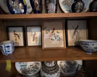 Four shelves devoted to the Asian decor in this home