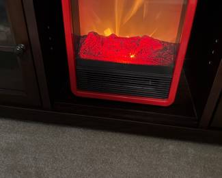 small indoor fireplace with remote