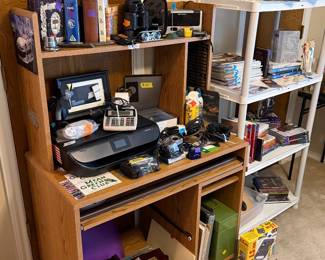 old records, printer, desk, cameras, binoculars, radio, ring doorbell