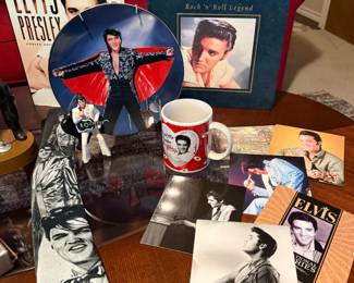 Plate, coffee mug, tie, books and photos