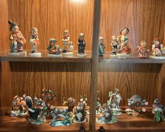Top shelf Hummel figurines - Below Lenox figurines.
