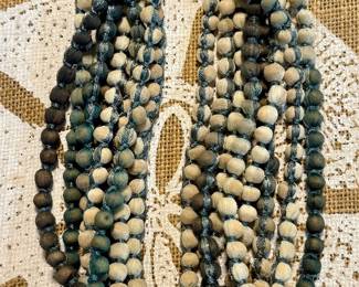 Extremely long, wood beads wrapped in silk