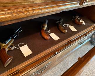 Collection of Replica Black Powder Pistols in Oak Display Cabinet