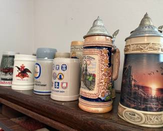 Collection of Ceramic Beer Steins including Budweiser, Munich Breweries, and Terry Redlin