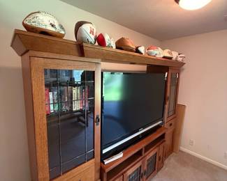 Oak Mission Style Entertainment Center with Display Cabinet and Signed Footballs