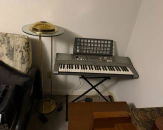 Yamaha digital keyboard. MCM Saturn floor lamp. 