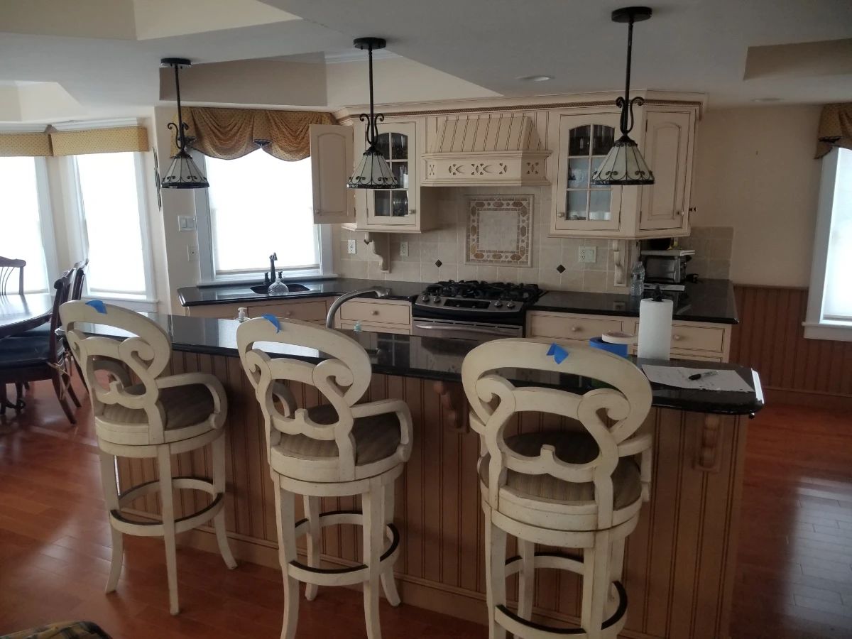 Custom kitchen cabinetry by Kountry Kraft. Bar stools - 3 available 