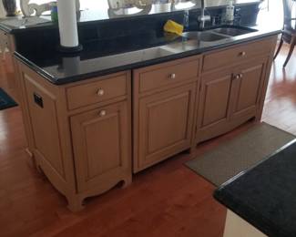 Kitchen island features bar seating, sink & dishwasher