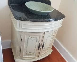 Handsome bath vanity with vessel sink