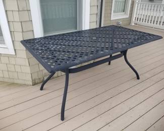 Patio dining set includes 6 chairs (available but not shown)