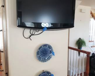 Flat screen TV with bracket; decorative plates