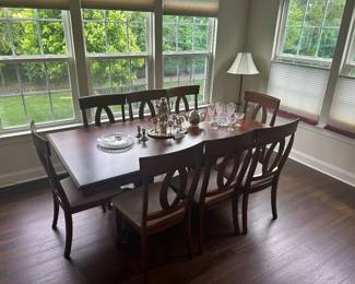 Dining table for 8 with leaf, table covers, and protective padding included