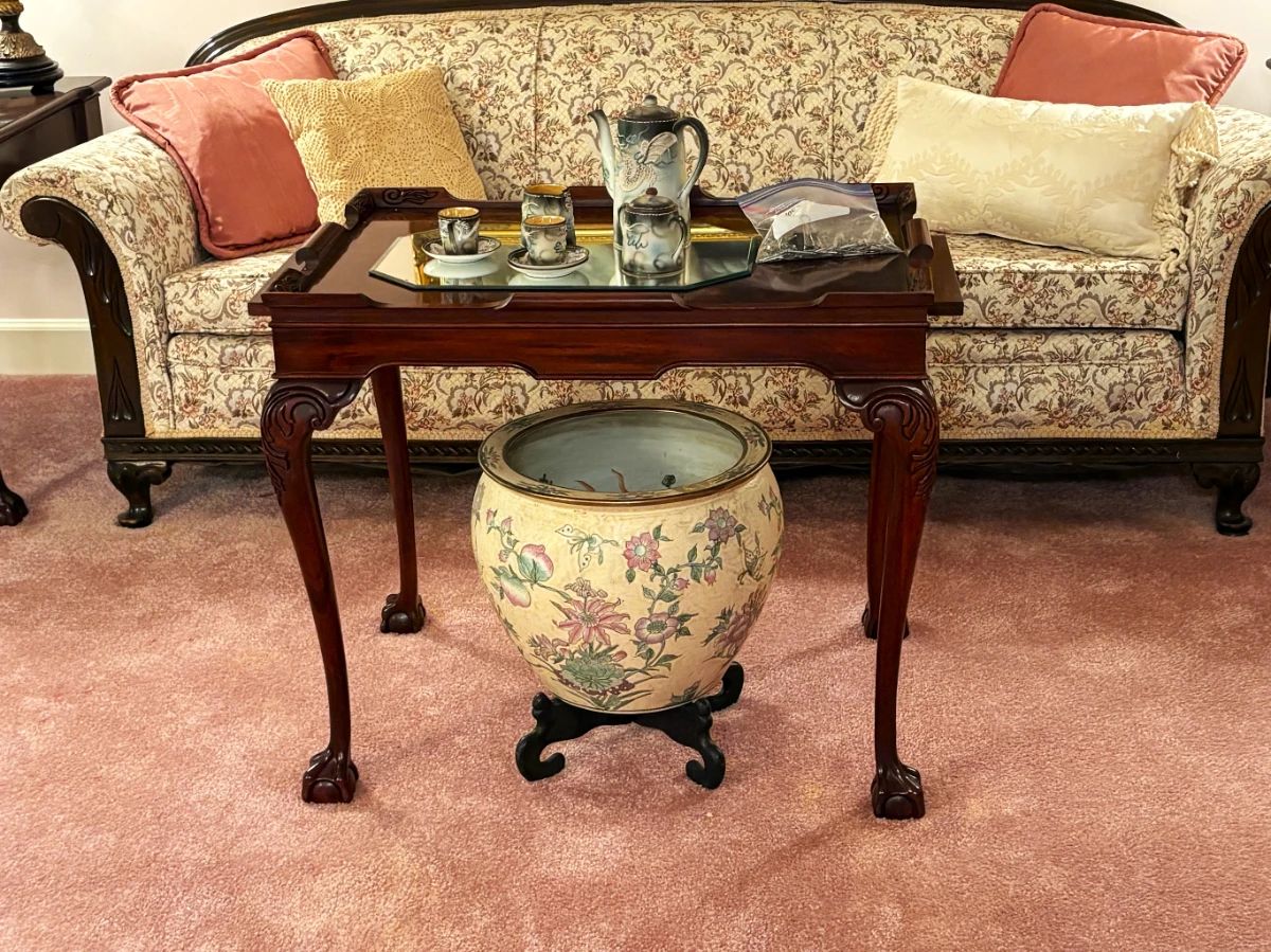 Formal living room with vintage/antique furnishings.  Oriental fish bowl
