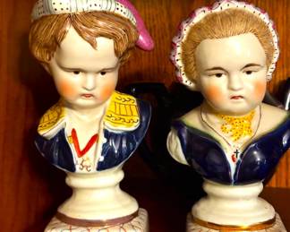 A pair of Staffordshire porcelain bust of Bourbon children